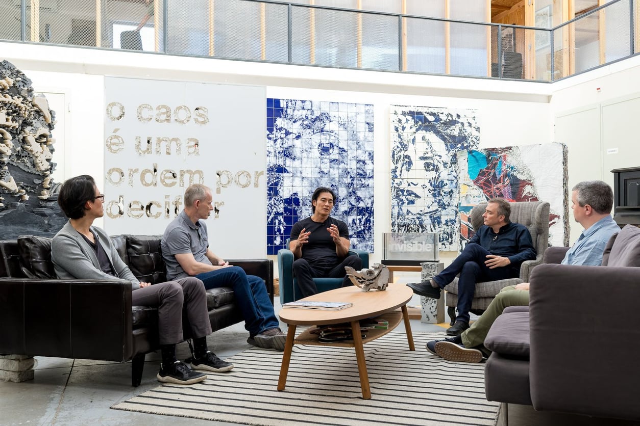 &Truth founders in conversation in a gallery lounge